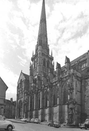 North front and crossing tower from the north west, fountain to the right