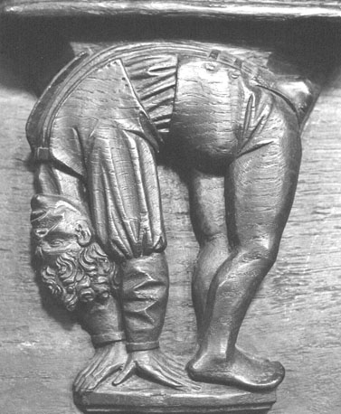Koorbanken, detail: misericorde met acrobaat