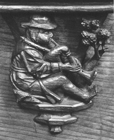 Koorbanken, detail: misericorde met doedelzakspeler