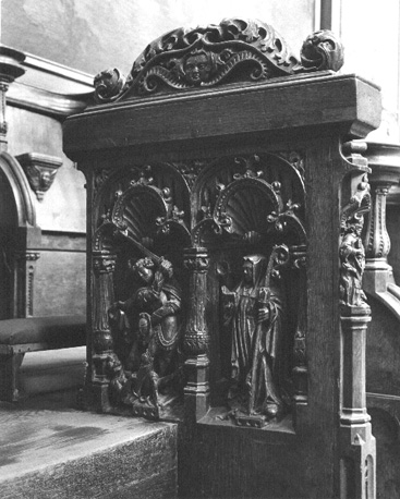 Koorbanken, detail: Michael vechtend tegen de draak (duivel) en de abdis Gertrudis van Nivelles