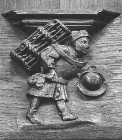 Koorbanken, detail: misericorde met schreeuwende vogelkoopman met mand op rug en hoed in hand