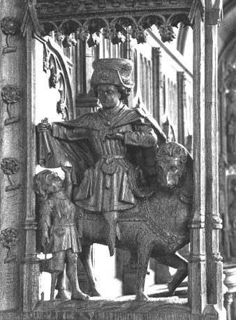 Koorbanken, detail: de heilige Martinus, zittend op een paard, deelt zijn mantel met een bedelaar
