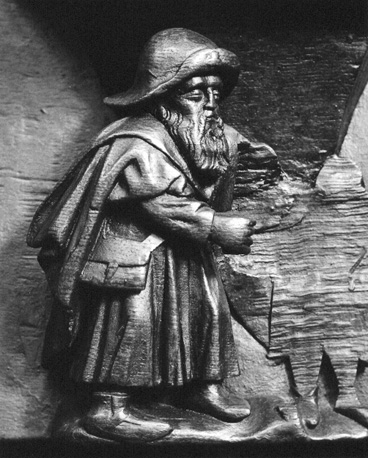 Koorbanken, detail: misericorde met een pelgrim (op zijn hoed het pelgrimsinsigne van Wilsnack)