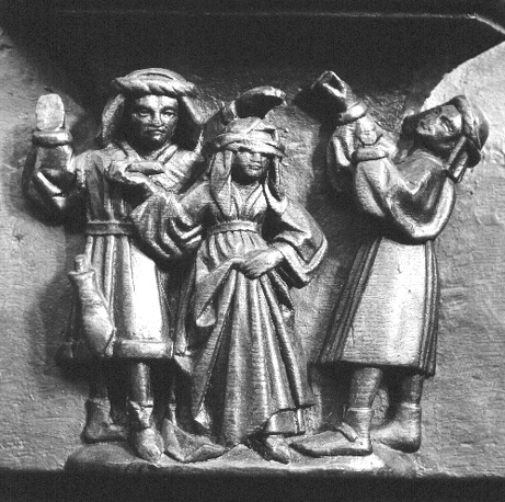 Koorbanken, detail: misericorde met vuurproef