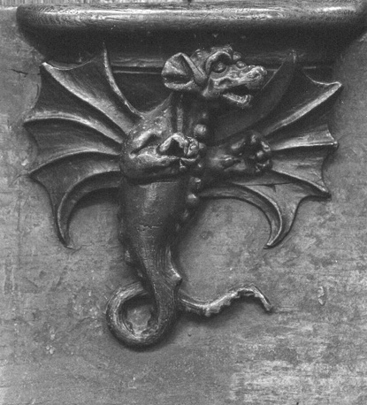 Koorbanken, detail: misericorde met een draak