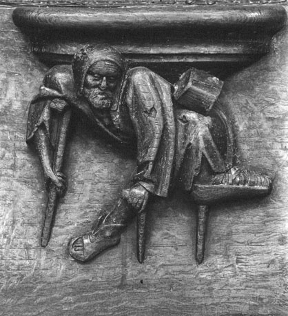 Koorbanken, detail: misericorde met kreupele bedelaar