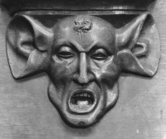 Koorbanken, detail: misericorde van man met zwijnenoren