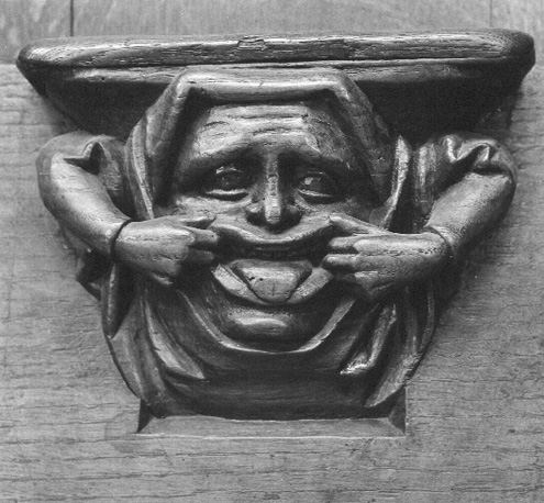 Koorbanken, detail: misericorde met iemand die grimassen maakt