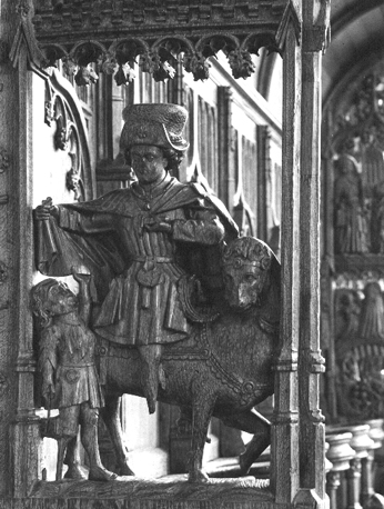 Koorbanken, detail: de heilige Martinus, zittend op een paard, deelt zijn mantel met een bedelaar
