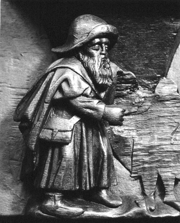 Koorbanken, detail: misericorde met een pelgrim (op zijn hoed het pelgrimsinsigne van Wilsnack)
