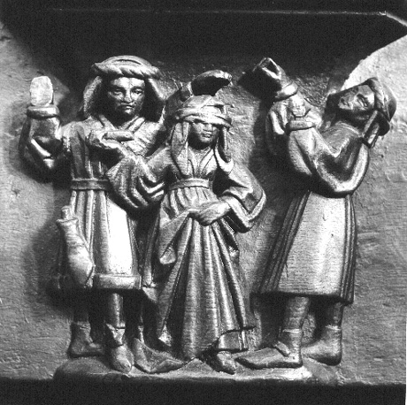 Koorbanken, detail: misericorde met vuurproef