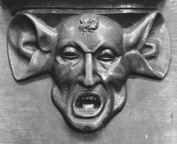 Koorbanken, detail: misericorde van man met zwijnenoren