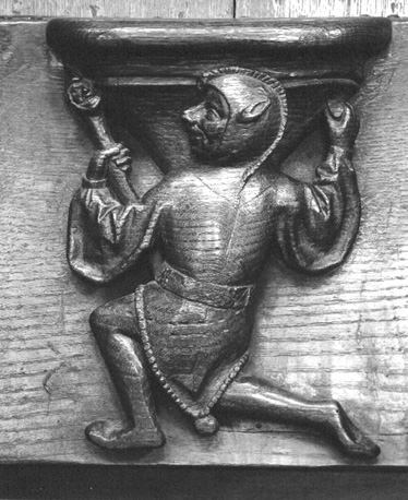 Koorbanken, detail: misericorde met een nar