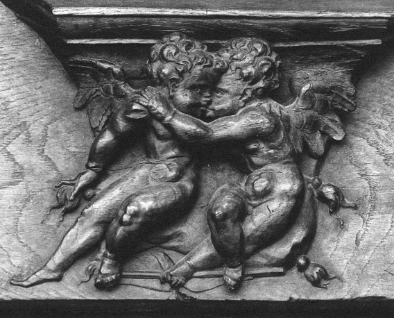 Koorbanken, detail: misericorde met twee engeltjes als kinderen weergegeven