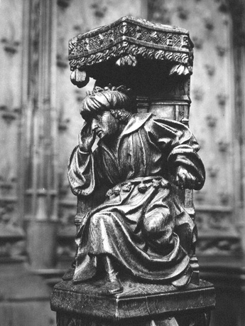 Koorbanken, detail: knop met dromende farao