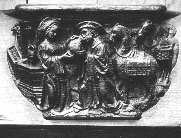 Koorbanken, detail: misericorde met Rebekka die de  bediende wat te drinken geeft