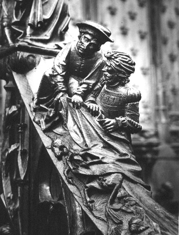Koorbanken, detail: knop met de broeders die Joseph's rok in het bloed van een geitenbokje dopen