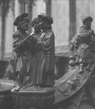 Koorbanken, detail: knop met drie mannen uit het Oude Testament
