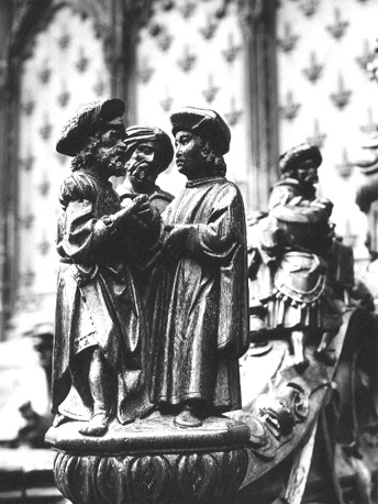 Koorbanken, detail: knop met drie mannen uit het Oude Testament