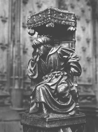 Koorbanken, detail: knop met dromende farao