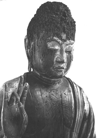 Boeddha, detail: kop, schouders, rechterhand