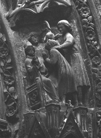 Noordtransept, oostelijk portaal ("Porte Rouge"), voussures: scènes uit het leven van sint Marcellus (detail)