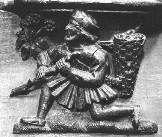 Koorgestoelte, detail: misericorde: de boodschapper