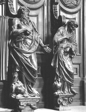Biechtstoel met twee beelden: sint Hiëronymus (met leeuw) en een personificatie van waakzaamheid (mensenfiguur met haan)