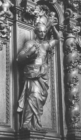 Koor, koorgestoelte, detail: engel met INRI-doek