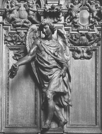 Koorgestoelte, detail: Engel met Passie-instrument: een hand