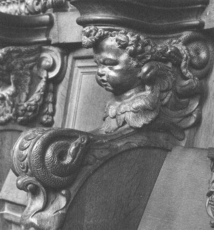 Koorgestoelte, detail: cupido / putto