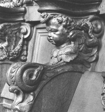 Koorgestoelte, detail: cupido / putto
