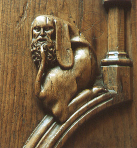 Koorgestoelte, detail, ornament: hybride wezen, menselijke en dierlijke vormen gemengd
