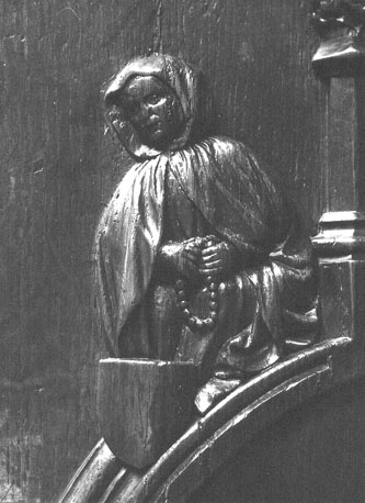Koorstoel, detail: vrouw met bidsnoer