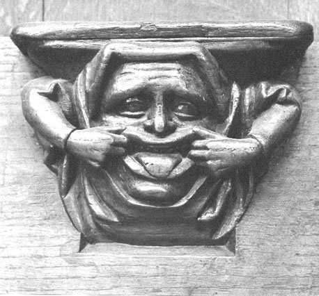 Koorbanken, detail: misericorde met iemand die grimassen maakt