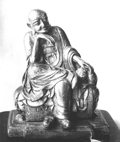 Zittend figuur
