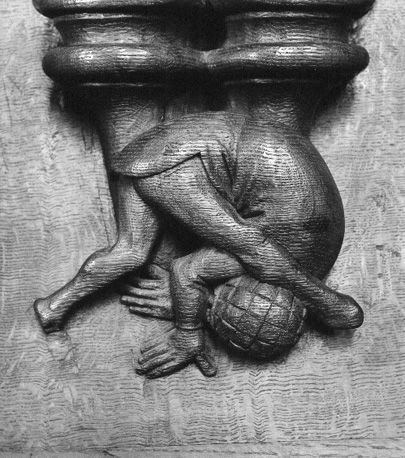 Koorgestoelte, misericorde: voorover rollend figuur (acrobaat ?)