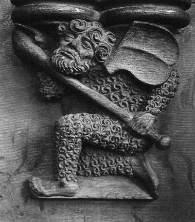 Koorgestoelte, misericorde: 'wildeman' (man bedekt met excessieve haargroei, met een knots), schild op zijn schouders