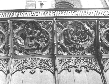 Koor, scènes bovenaan koorgestoelte: (links) Christus verdrijft de geldwisselaars uit de tempel; (rechts) Laatste Avondmaal