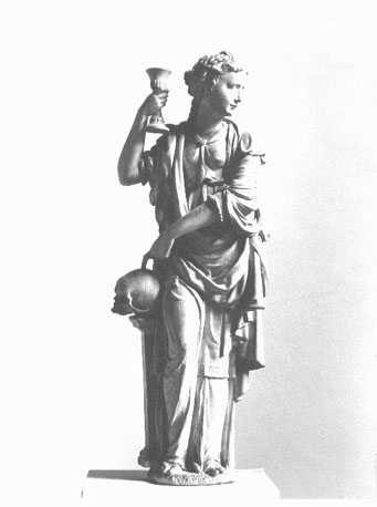 Staand vrouwenfiguur, met een kelk in haar rechterhand, haar linkerhand wijzend op een schedel: personificatie van het Geloof / Fides