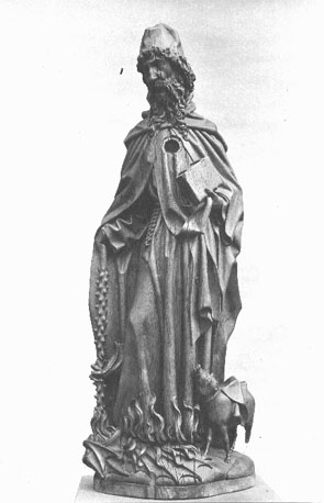 Sint Antonius Abt, boek in zijn linkerhand, staf, vlammen en varken; rond gat in zijn borst